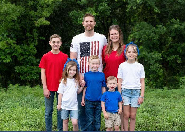 Jake Bair with family outdoors